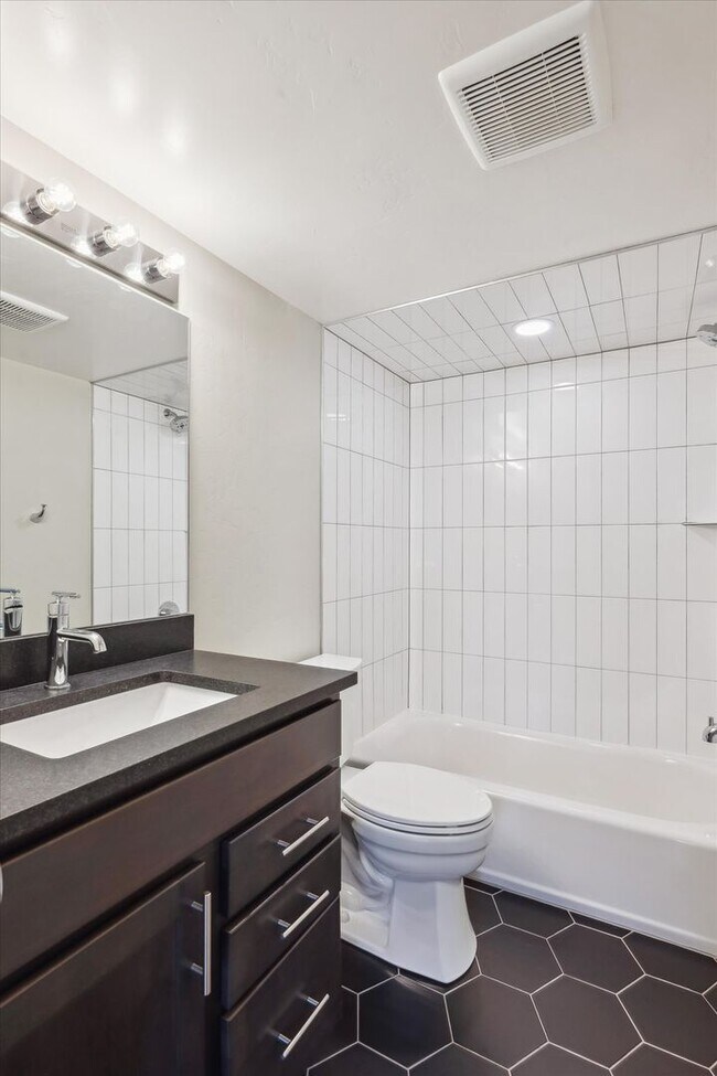 Building Photo - Modern 4-Bedroom Townhome with Rooftop Deck Near Sloan’s Lake & Light Rail