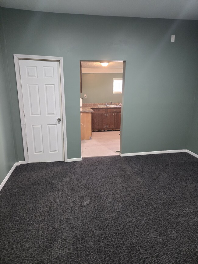 Living room towards kitchen $ bathroom door - 311 Fountain St