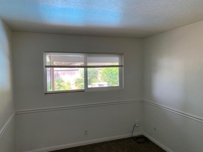 Building Photo - Enjoy the Backyard Pool at This 4-Bedroom ...