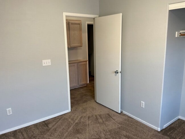 Building Photo - 3 Bedrooms 2.5 Bathrooms 2 car attached garage Gated Subdivision