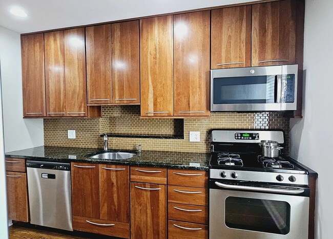 Building Photo - Upscale Living at Its Finest