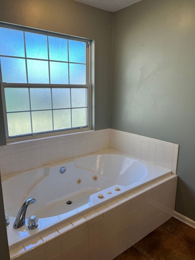 Building Photo - Four bedroom with a fenced in yard!