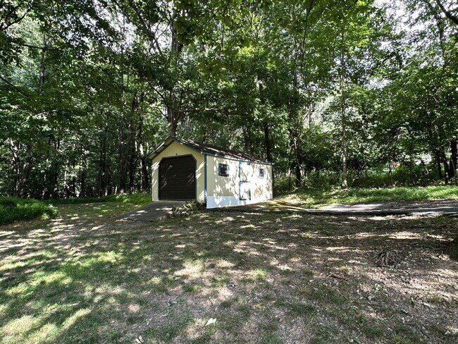 Building Photo - 3-Bedroom Split Level in Peaceful Wooded Setting