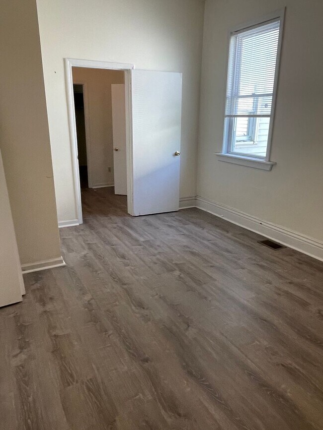 Building Photo - Updated three bedroom two bathroom home in...