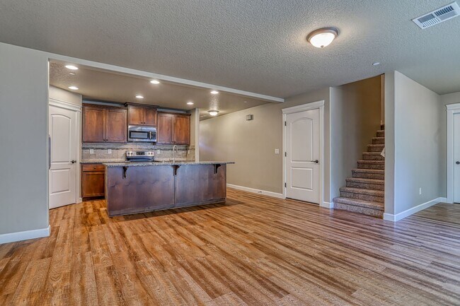 Building Photo - Centrally Located 4 Bedroom Townhome with Attached Garage & AC