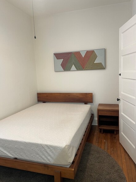 Bedrooms come furnished with a bed, night stand, dresser... and art! - 3489 N Elston Ave