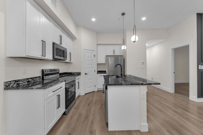 Building Photo - All Units Are Available With Brandnew Full Appliance Package