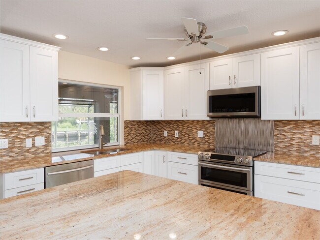 Building Photo - 3 BEDROOM • 2 BATHROOM • PRIVATE POOL • WATERFRONT • BOAT LIFT • ZERO DEPOSIT MOVE-IN AVAILABLE