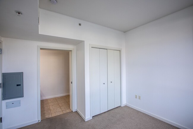 Building Photo - Sweet + secure 1/1 condo with parking, extra storage room + AC available now!