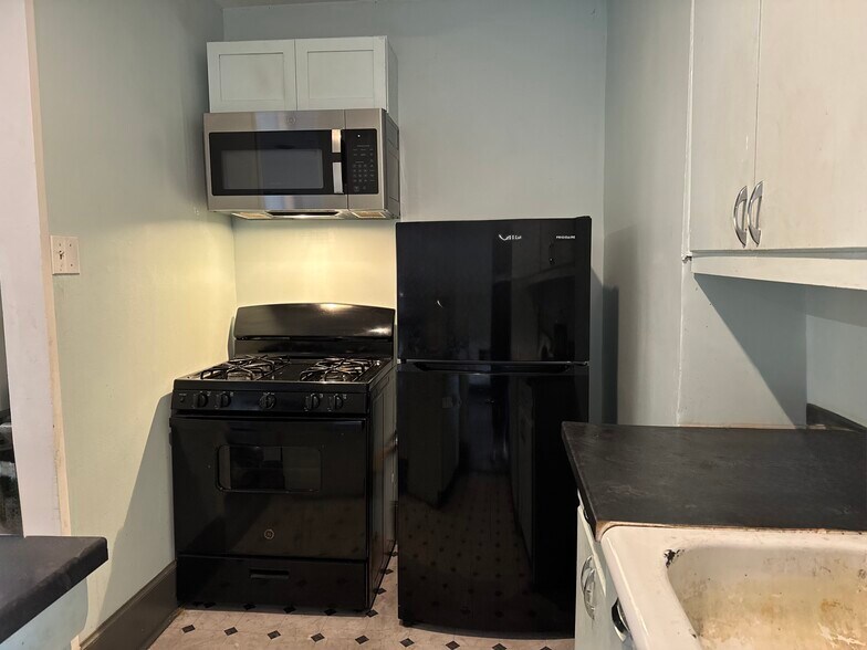 Kitchen, plans to update sink and cabinets. - 100 W King St