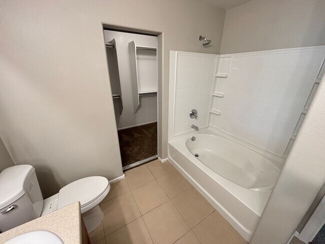 Building Photo - Spacious Tri-Level 4-Bedroom Home with Bal...