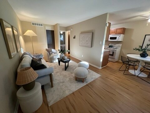 living, dining flows into kitchen and bedroom - 3393 Madison Ave