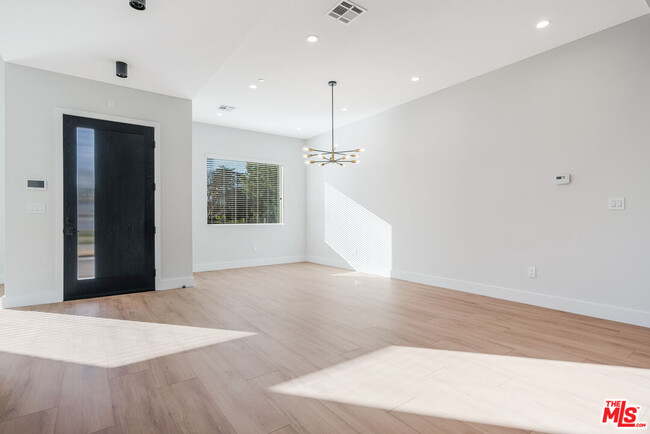 Building Photo - 8670 Encino Ave