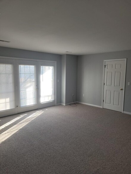 living room opens to balcony, gas log fireplace - 2775 N Forest Rd