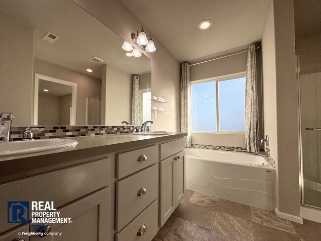 Building Photo - Spacious 4-Bedroom Home with Fenced Yard & 2-Car Garage Near JBLM!