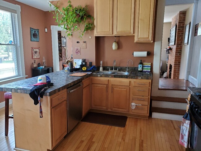 Kitchen. Living room accesible from both left and right. - 241 Benton St