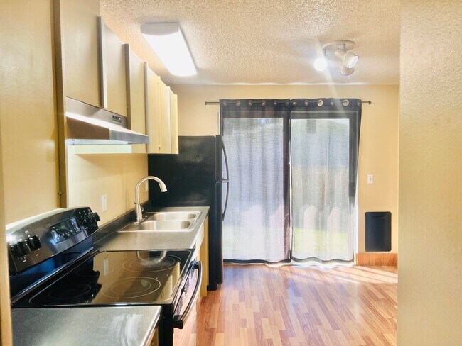 Building Photo - Charming 3BR/1BA w/ 1-car garage, long driveway, fenced yard, wood stove & shed/workshop.