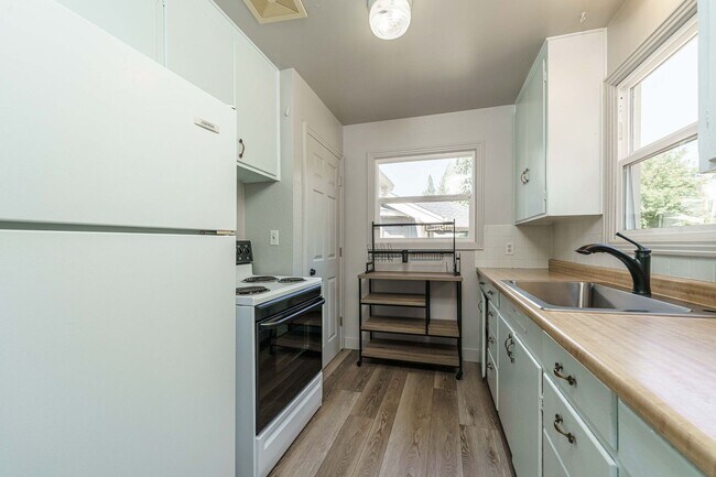 Building Photo - MOVE IN SPECIAL - Charming 1950’s Two-Bedroom with Character & Shared Outdoor Space