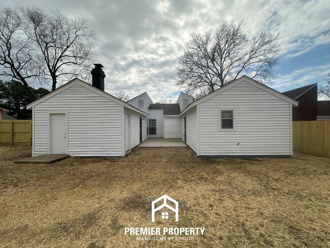 Building Photo - Quiet 3BR/2BA Cove Near Southwind | Soaring Ceilings & Floor-to-Ceiling Stone Fireplace