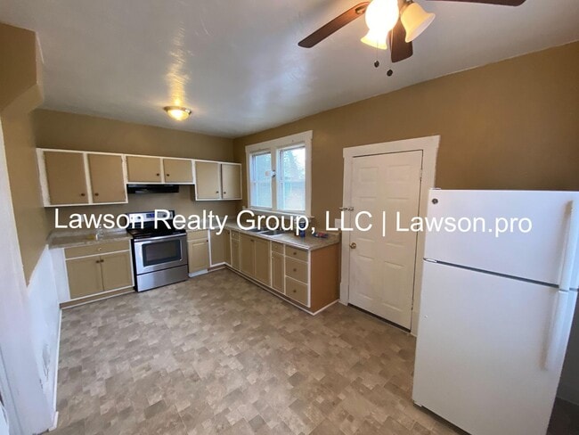 Building Photo - Updated Three Bedroom with Flat Yard