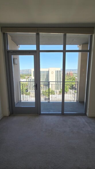 Guest bedroom and balcony - 175 W Saint James St