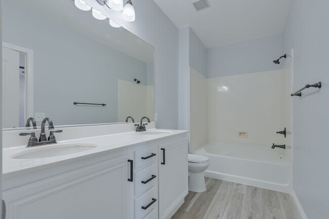 Building Photo - NW!! Gated!! Community Pool/Spa  Recreation Room!! New Paint!! New Flooring!!  Balcony!!  2 car g...