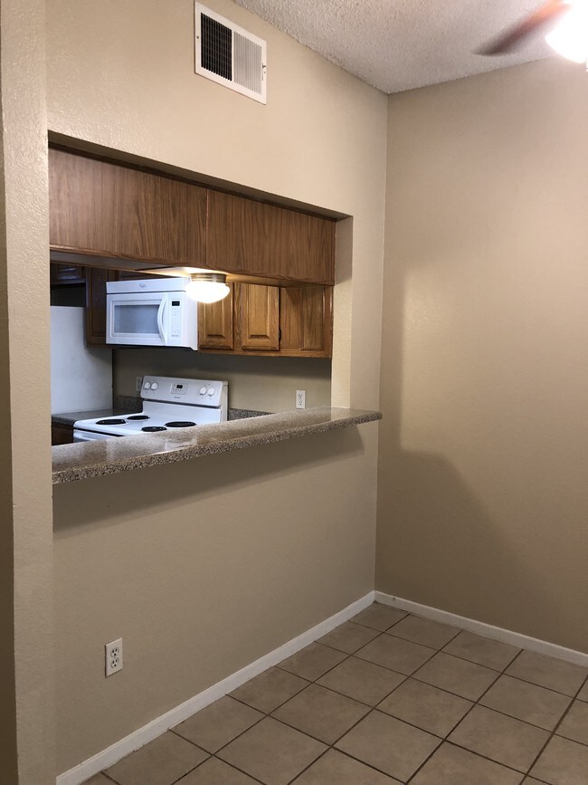 Kitchen open to living area - 5401 Chimney Rock Rd
