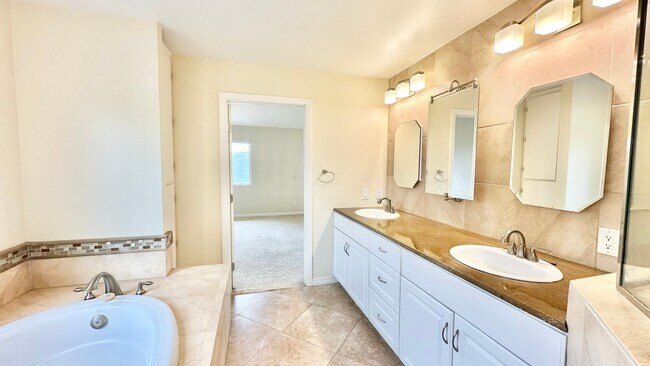 Building Photo - Spacious Two-Story Home with Three-Car Att...