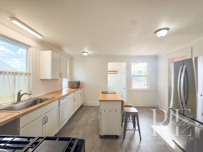 Building Photo - Light-Filled Home with Vaulted Ceilings, Bonus Basement & Walkable Location