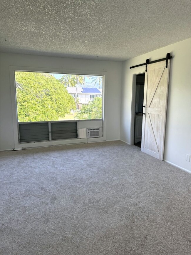 Building Photo - Koko Isle Circle - 3 bedroom, 2 full bath, 1 half bath with two car carport