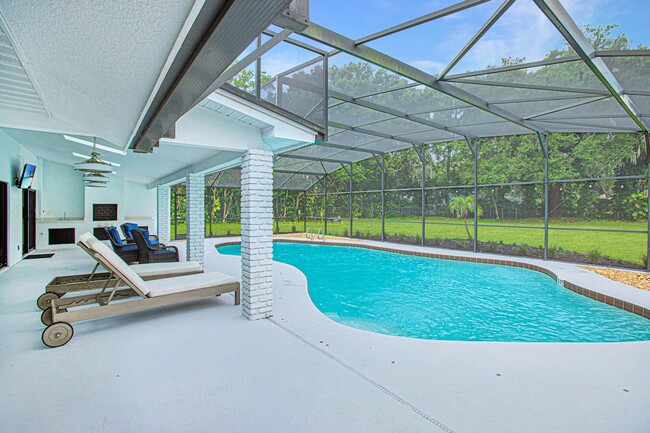 Building Photo - Beautifully Updated 3/2 Pool Home with Large Backyard in Lake Ajay (Gated Community)