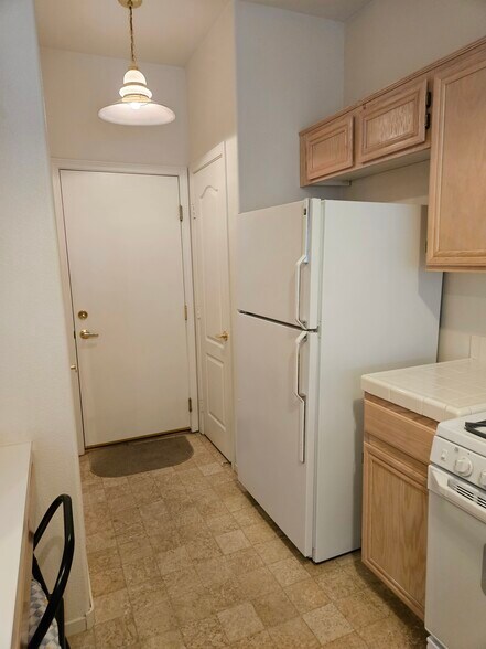 Kitchen and garage access - 5252 Sunny Beach Ln