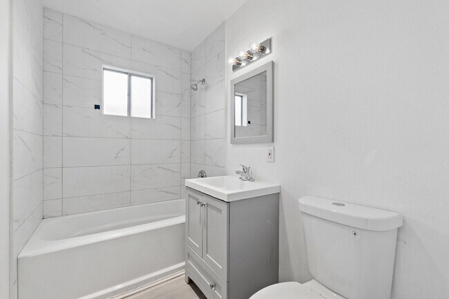 Building Photo - Welcome to this modern, remodeled condo!