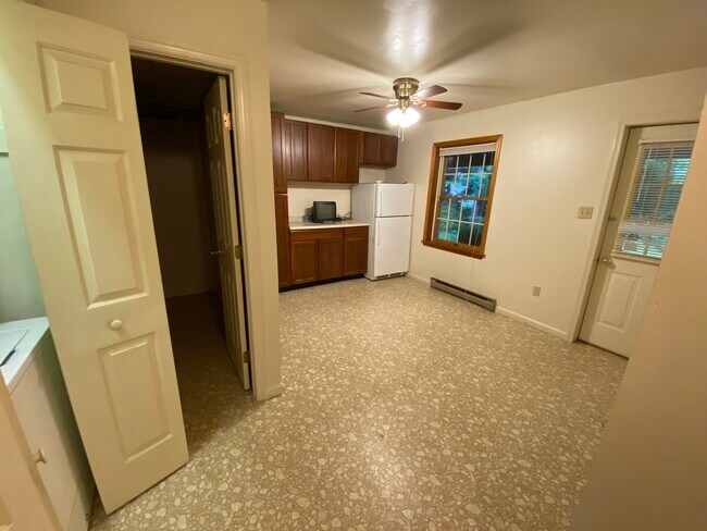 kitchen and door the covered back porch - 104 E Poplar St