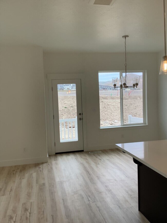 Building Photo - MAKE YOUR FIRST RENT PAYMENT UNTIL 2026-New Construction Townhome Located in Prime Saratoga Sprin...