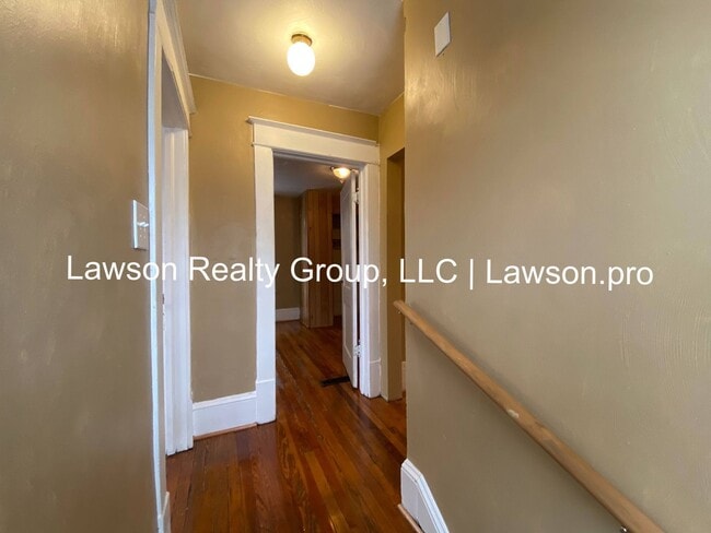 Building Photo - Updated Three Bedroom with Flat Yard
