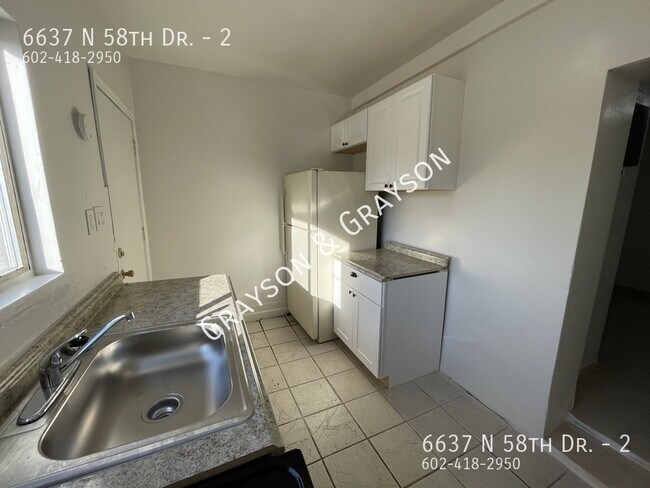 Building Photo - 6637 N 58th Dr