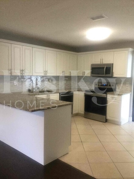 Building Photo - 5896 Triphammer Rd