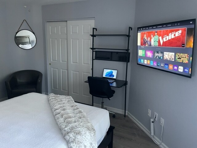 Guest Bedroom with work space and 50-inch flat screen. - 850 S Tamiami Trl