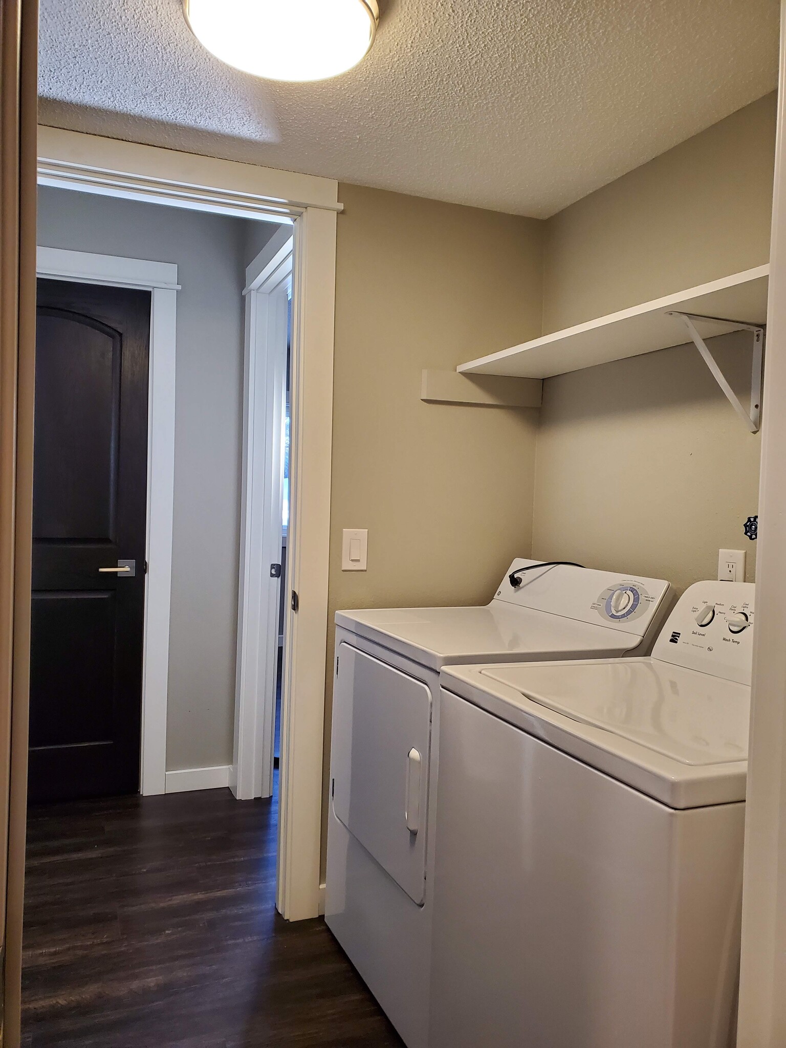 Laundry is located in the lower level and has a door to close it off from living spaces. - 2525 Cedar Hills Drive