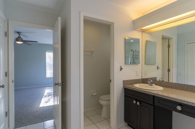 Building Photo - Beautiful 4/2 home Located on a tree lined street in the gate of country club community of the Hu...