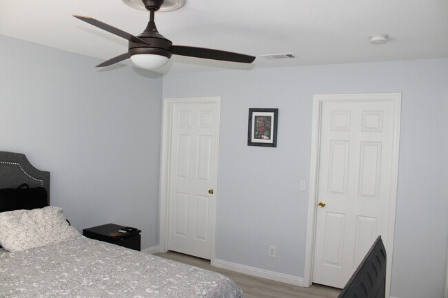 Master Bed, doors to en suite & walk-in closet - 7736 Allerton Ave