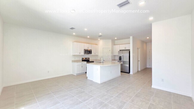 Building Photo - OUTSTANDING BRAND NEW TOWNHOME MOVE IN READY! AZARIO TOWNHOMES LWR !