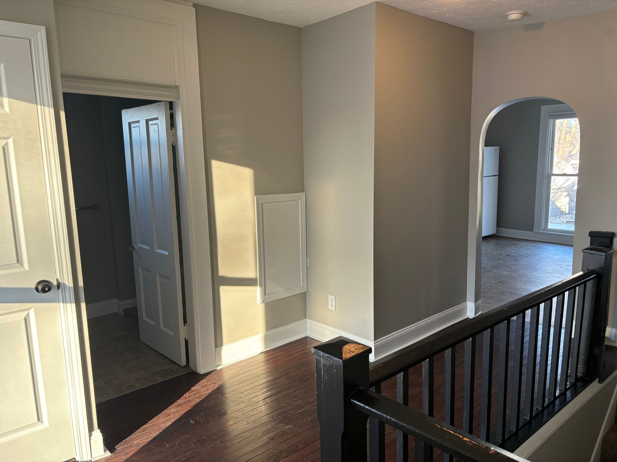Hallway with view of bathroom door (left) and entry to kitchen - 1394 Wayne St