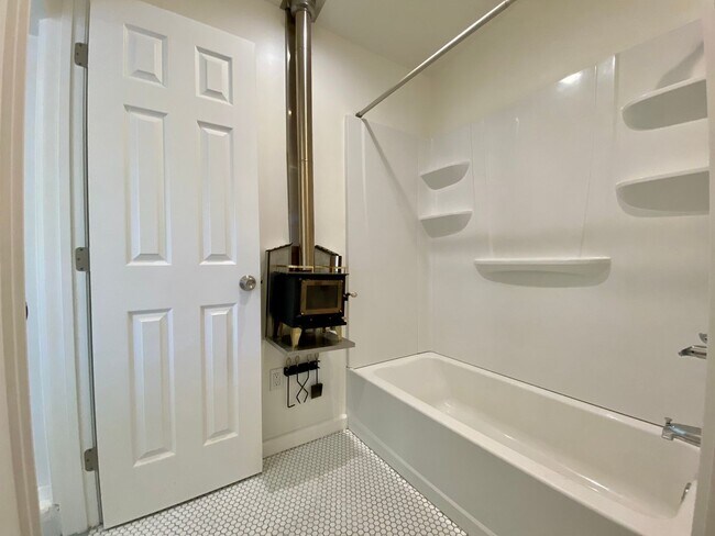 Building Photo - Remodeled 3BR, 2BA with Orchard, Garage & ...
