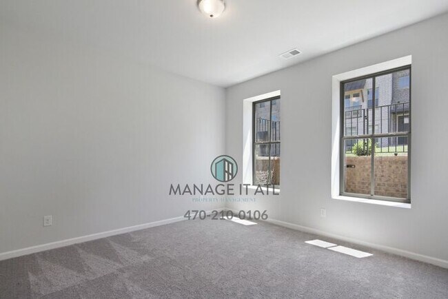 Building Photo - Modern 3-level Townhome featuring 4 bedroo...