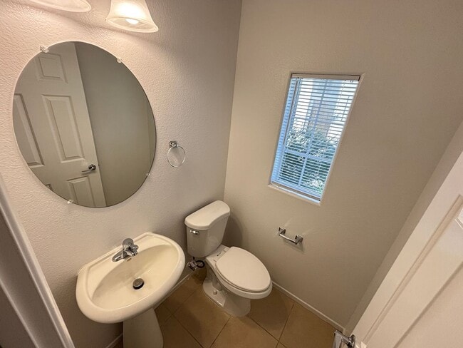 Building Photo - Spacious Tri-Level 4-Bedroom Home with Bal...