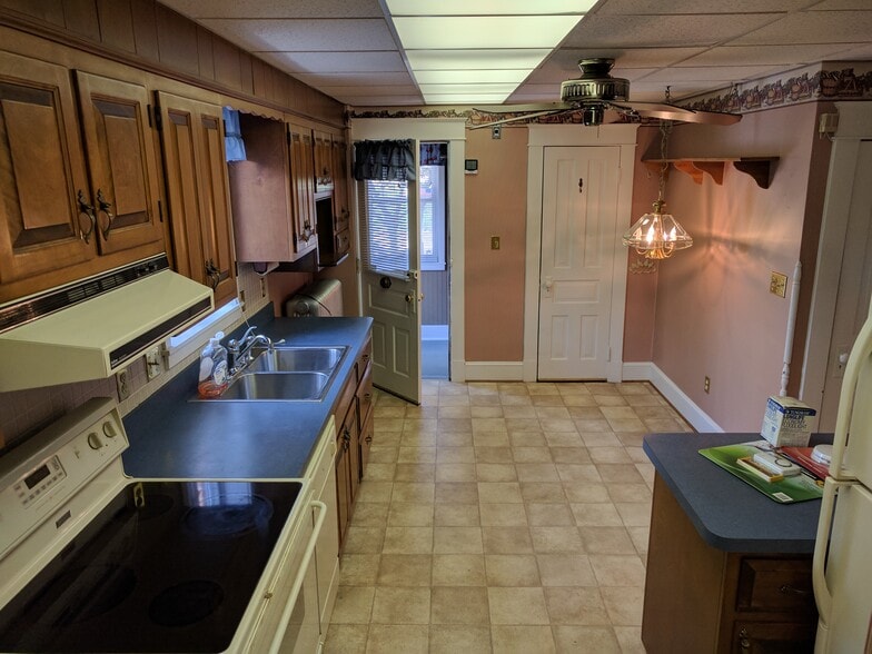Kitchen with door to mud room (left), and door to pantry (right). NOTE: all pictures were taken before the interior was repainted - none of the old wall paper remains. - 925 North Market Street