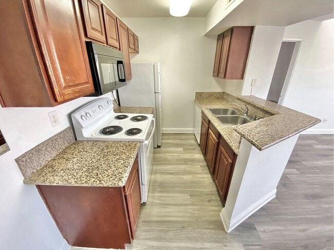 Building Photo - CONDOMINIUM IN A GATED COMMUNITY WITH 2 BE...