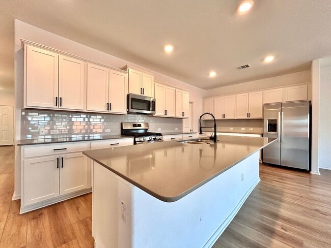 Building Photo - Spacious 4/BR 2.5/BA Two-Level Home with 3-Car Garage & Covered Deck